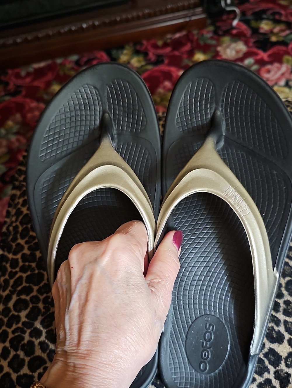 OOFOS Black Foam Flip Flops with Metallic Gold Straps